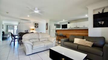 Family House, 3 Bedrooms, 2 Bathrooms, Pool View | Living area | 55-inch LCD TV with digital channels, TV, video game console