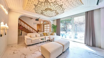 Family House, Multiple Beds | Living area | Flat-screen TV, video-game console