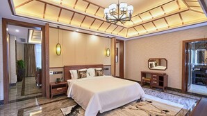 Suite Deluks | Seprai antialergi, selimut bulu angsa, busa memori, dan minibar gratis