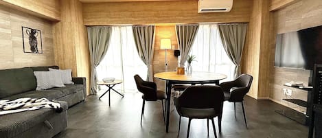 Superior Apartment | Living area | 50-inch flat-screen TV with digital channels, TV, tablet
