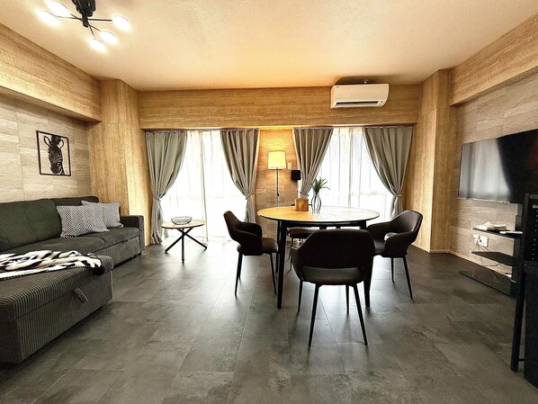 Superior Apartment | Living area | 50-inch flat-screen TV with digital channels, TV, tablet