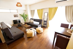 Superior Apartment | Living area | 50-inch flat-screen TV with digital channels, TV, tablet - Reve K 302 (Naha)
