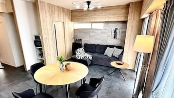 Superior Apartment | Living area | 50-inch flat-screen TV with digital channels, TV, tablet