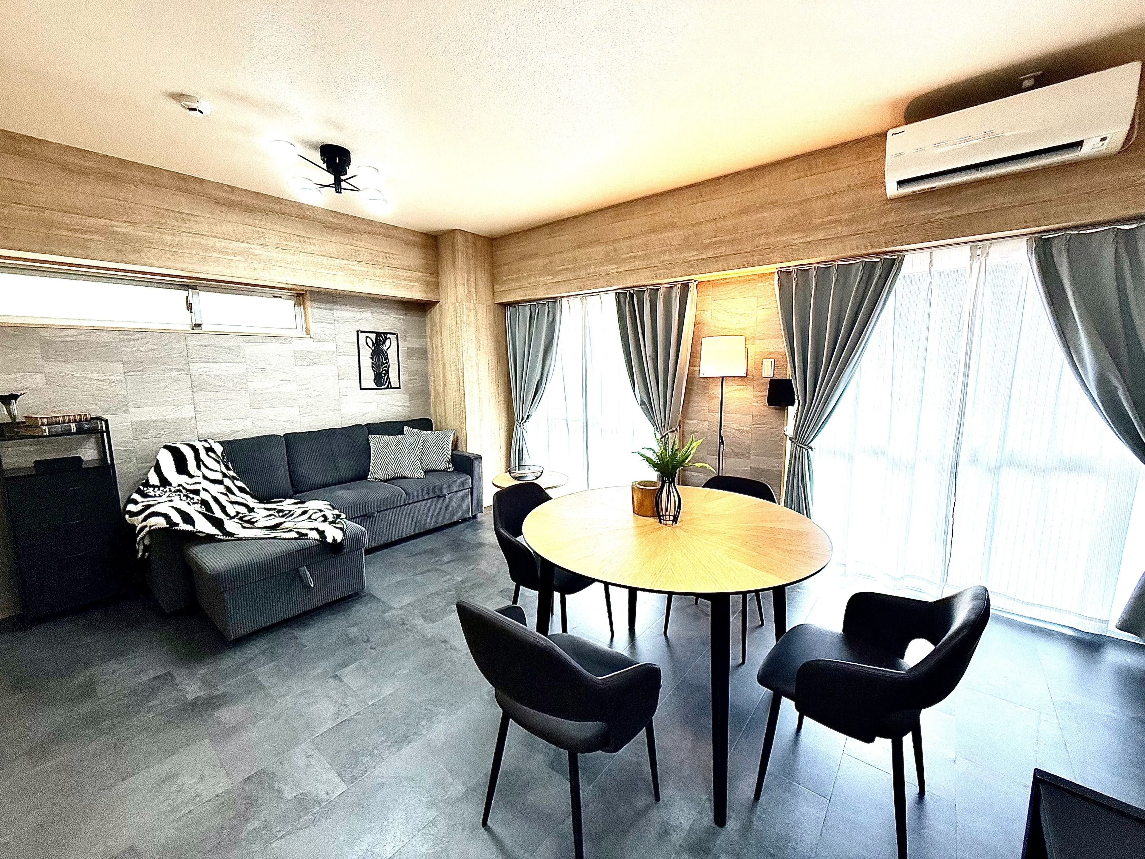 Superior Apartment | Living area | 50-inch flat-screen TV with digital channels, TV, tablet