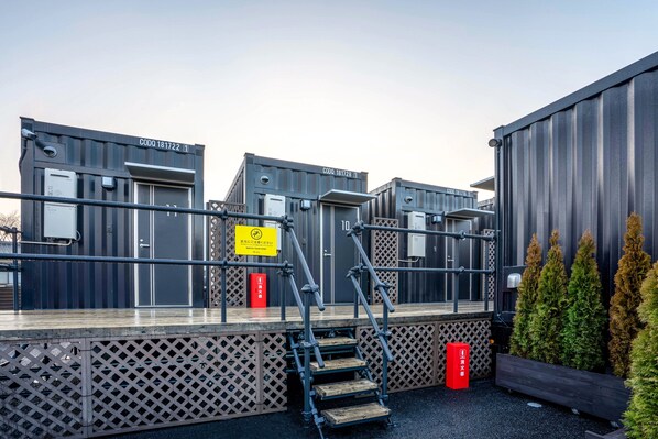 A building with multiple units, each marked with a unique CODQ number.