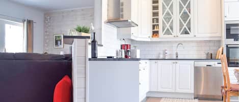 Fridge, stovetop, dishwasher, coffee/tea maker