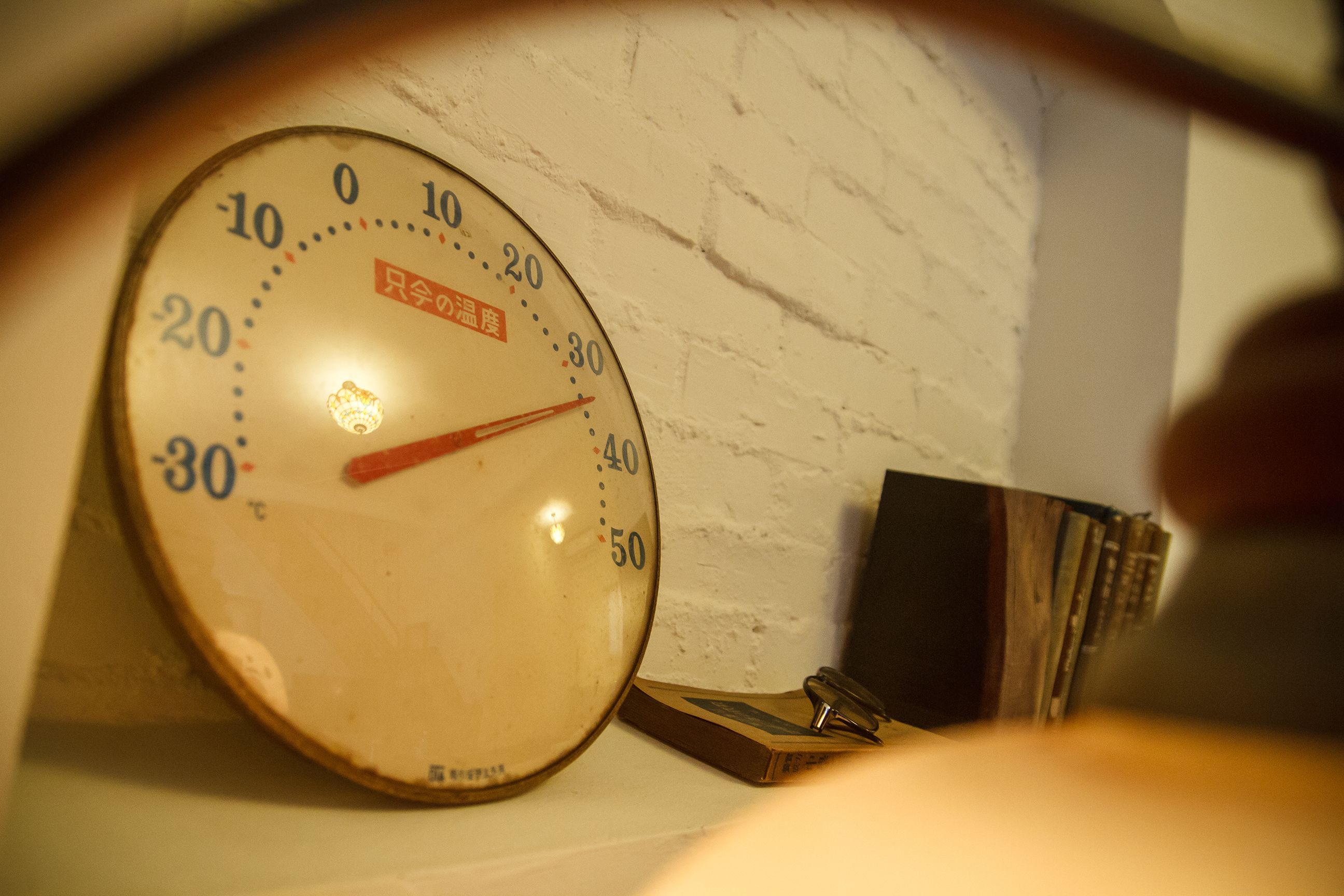 A bathroom scale with a white wall in the background.