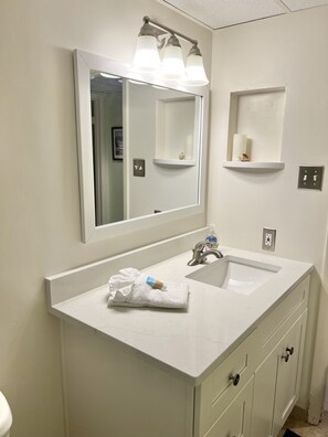Combined shower/tub, hair dryer, towels, soap