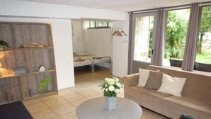 Family Studio, Multiple Beds, Accessible, River View | Living area - Hôtel Restaurant Le Chalet du Montal (Dun-les-Places)