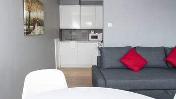 Apartment, 1 Bedroom | Living area | Flat-screen TV
