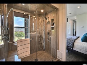 Bathtub, hair dryer, towels, toilet paper