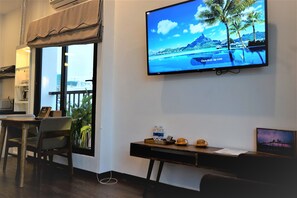 Family Studio, Non Smoking, Balcony | Living area | 49-inch LED TV with digital channels, TV, Netflix - Oasis Hotel & Apartment (Da Nang)