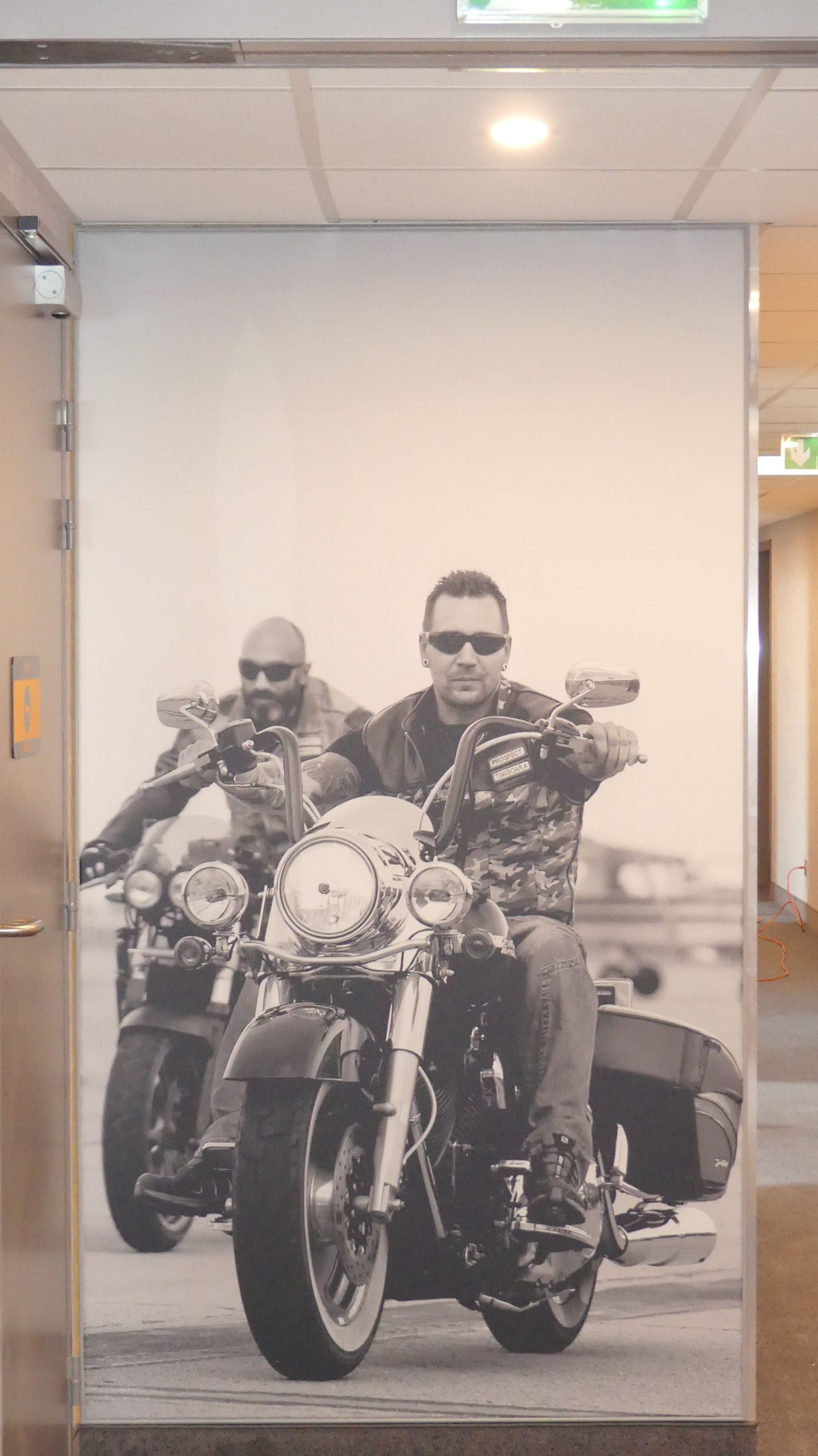 A poster of two men on motorcycles with a name tag reading "PROSPECT THOMPSON".