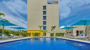 Outdoor pool, open 8:00 AM to 8:00 PM, pool umbrellas, sun loungers