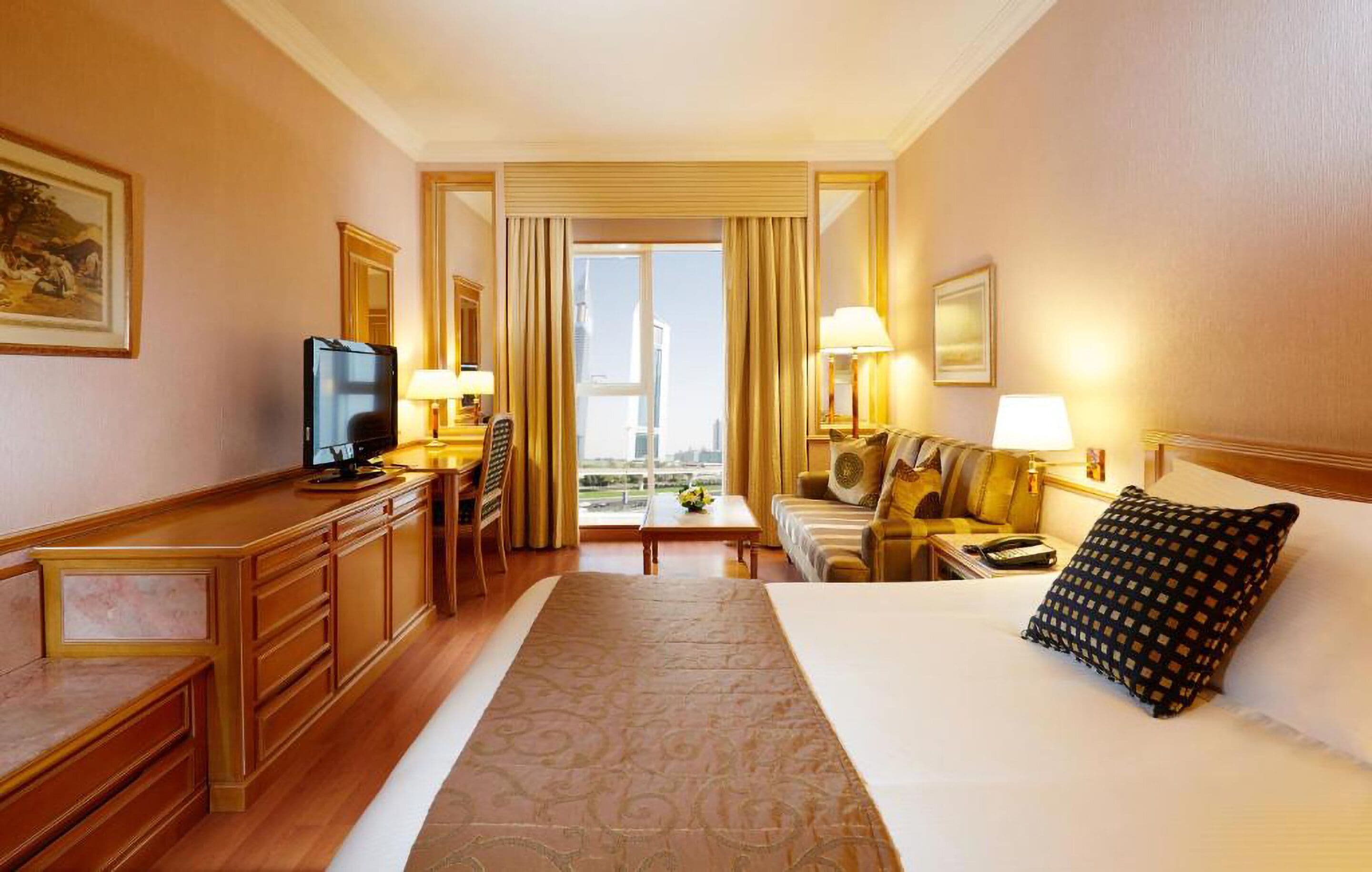Junior Suite (with Sheikh Zayed Road View) | Minibar, in-room safe, desk, laptop workspace