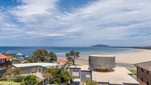 A coastal residential area with houses, a beach, and a mountain in the distance. - Mistral, Gerroa, South Coast (Gerroa)