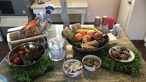 A kitchen counter with various food items and kitchenware.
