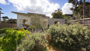 A modern two-story house with a brick facade and large windows. - HOME SWEET HOME - MOUNT MARTHA (Mount Martha)