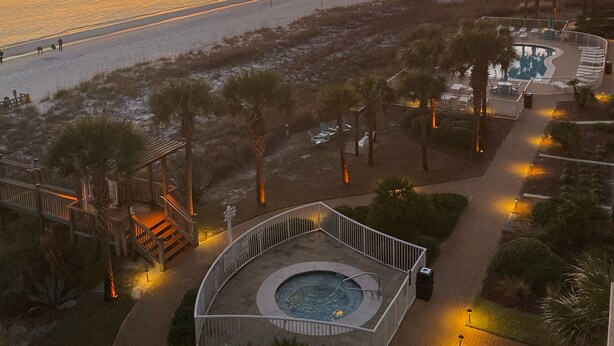 A resort with a pool, palm trees, and a beach view. - 🏖Beachfront Retreat on Perdido Key. Two Pools, Hot Tub, and Gym🏖 (Perdido Key)