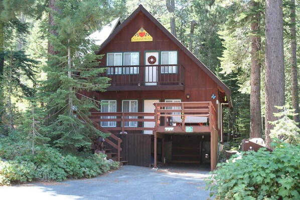 Experience the tranquility of Zugspitzhaus, a secluded lodge nestled among the forest's lush canopy.