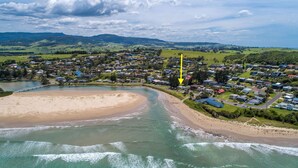An aerial view of a coastal town with a beach, houses, and a river. - Seaways, Gerroa, South Coast (Gerroa)