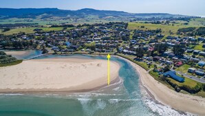 An aerial view of a coastal town with a beach, houses, and a bridge. - The Beach House, Gerroa, South Coast (Gerroa)