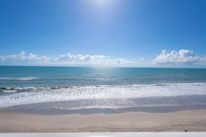 On the beach, sun loungers, beach towels