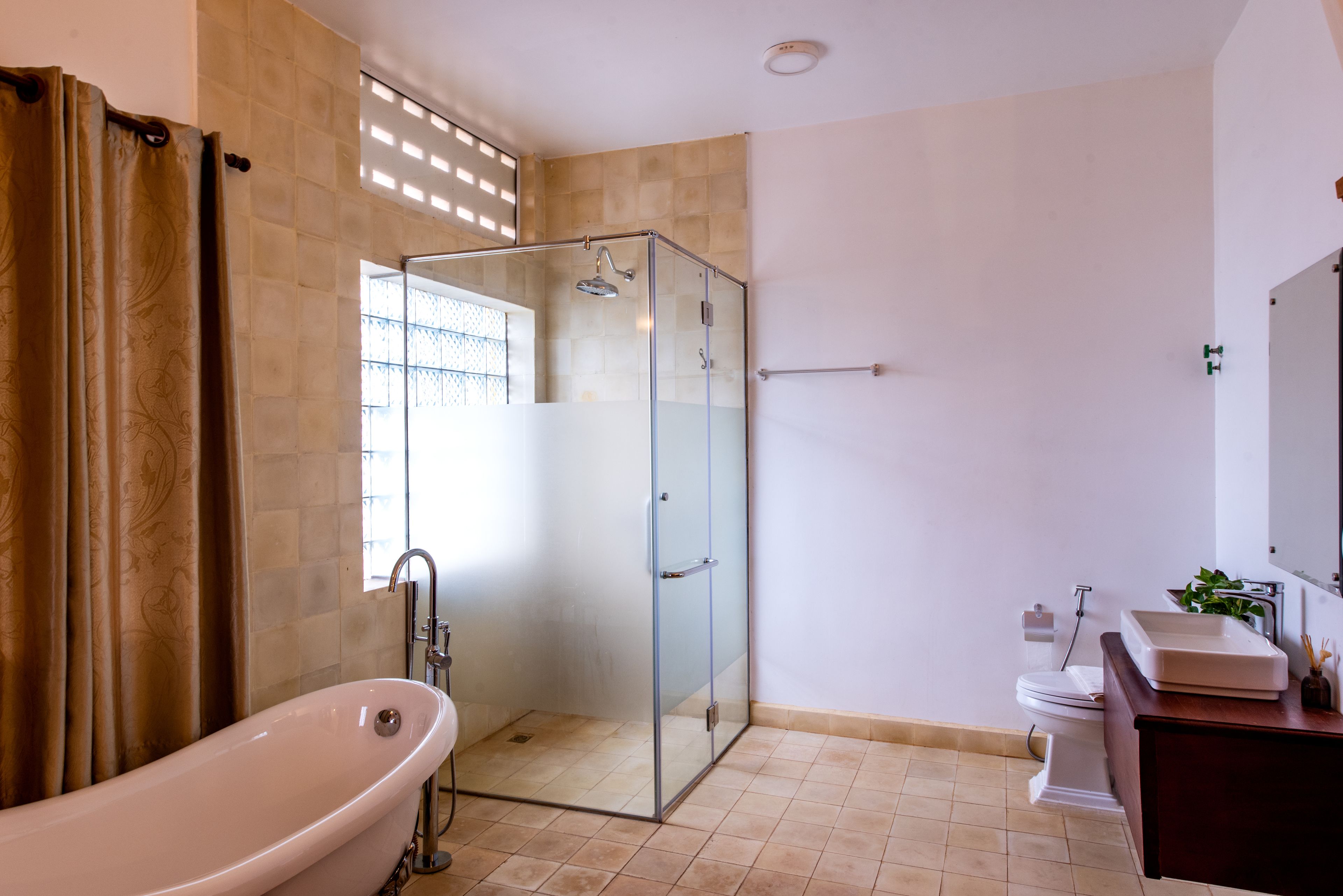 separate bathtub and shower, deep-soaking bathtub, rainfall showerhead