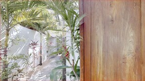 A wooden structure, possibly a door or panel, with a textured surface.