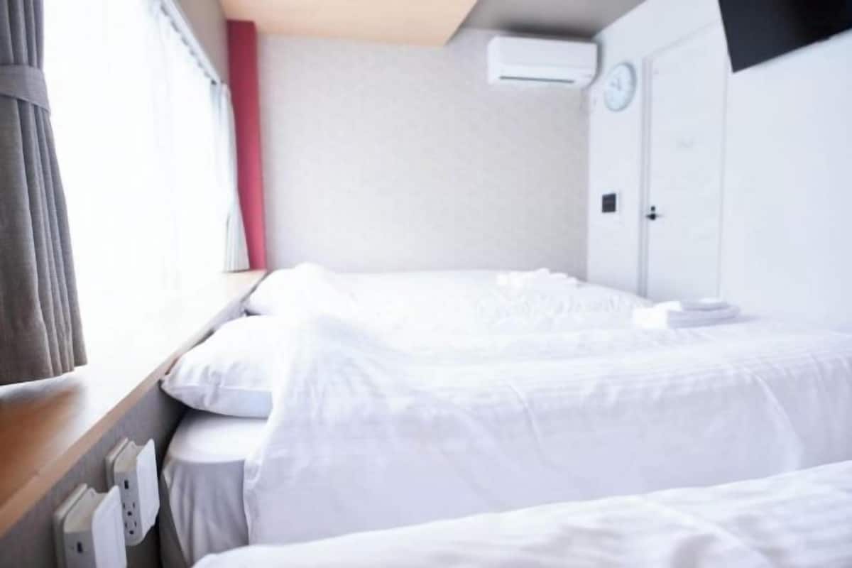 Hypo-allergenic bedding, desk, blackout drapes, soundproofing