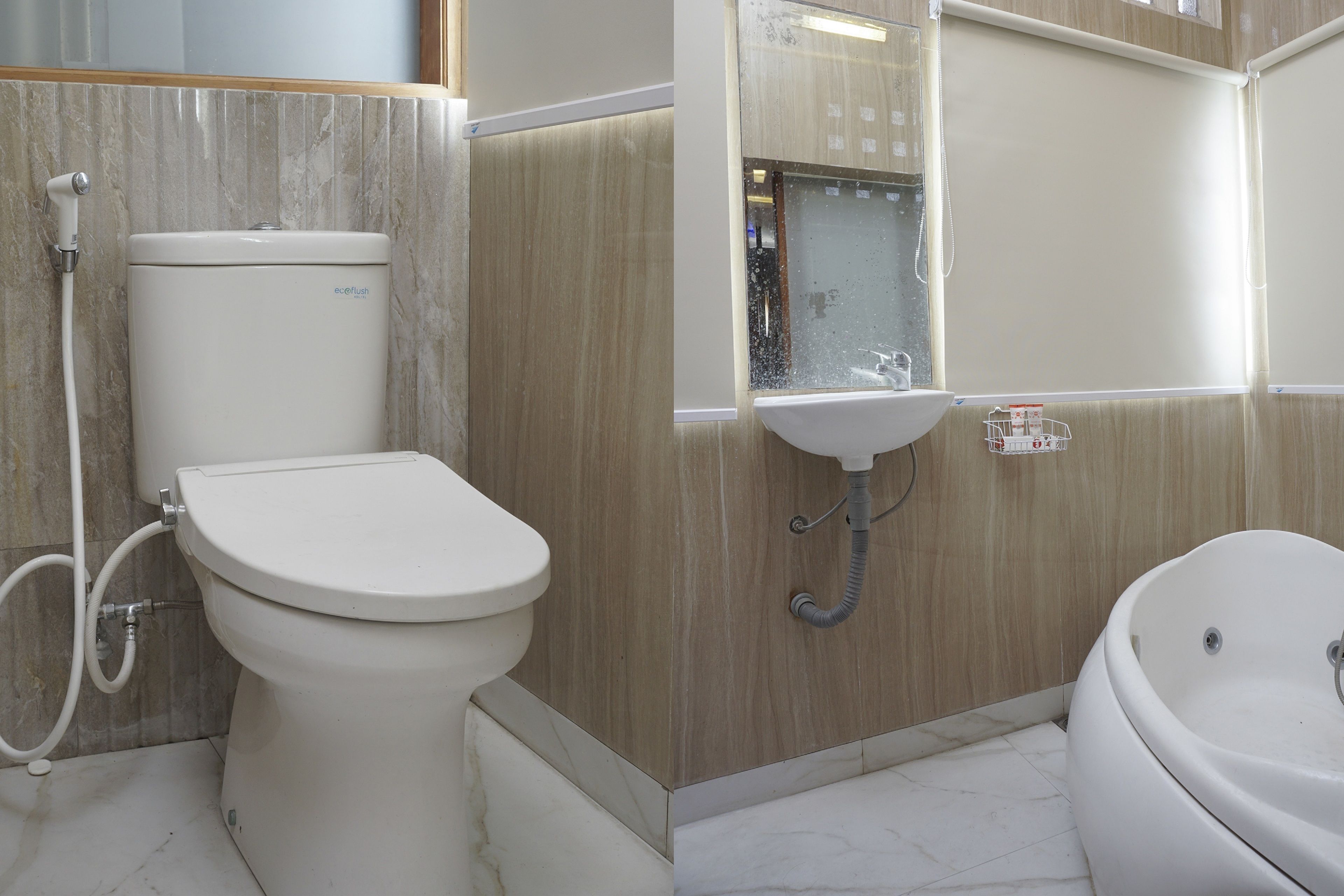 A bathroom with a toilet, sink, and bathtub.