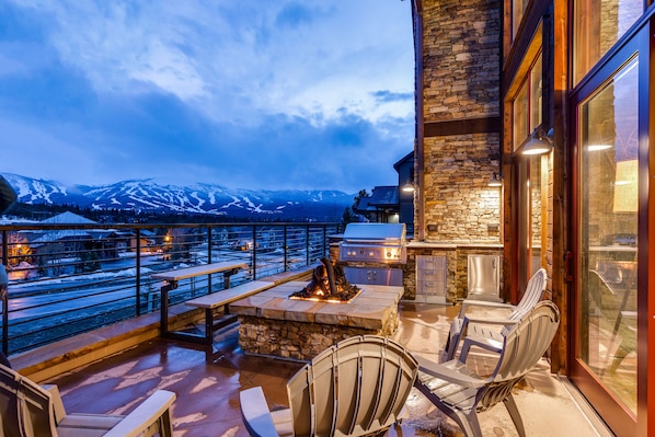 Relax on the patio with a fire pit, Adirondack chairs, and a grill, taking in the breathtaking views of the surrounding mountains and water.
