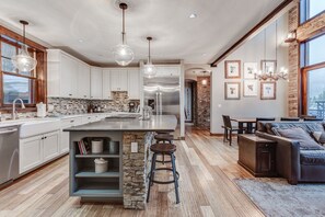 Enjoy cooking in the spacious kitchen with a large island, sink, and ample counter space.