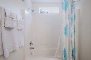 Combined shower/tub, hair dryer, towels, soap