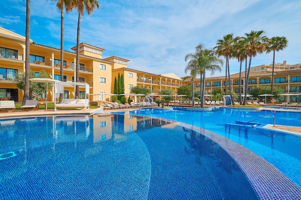 Indoor pool, outdoor pool, open 8:00 AM to 8:00 PM, pool loungers