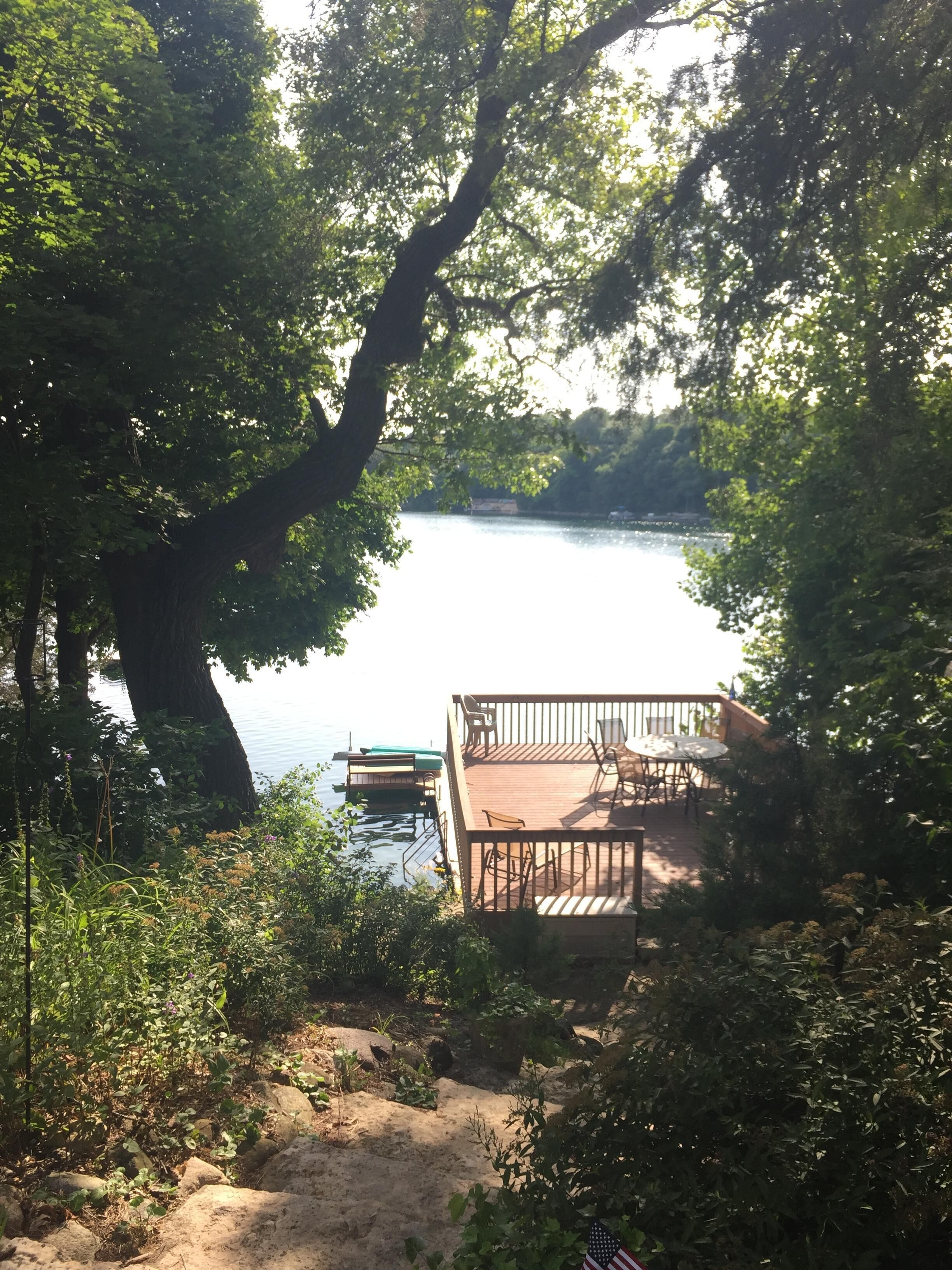 This large sunny deck  is the perfect gathering place overlooking  Moose Lake.