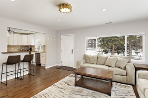 Living room on the right and kitchen on the left