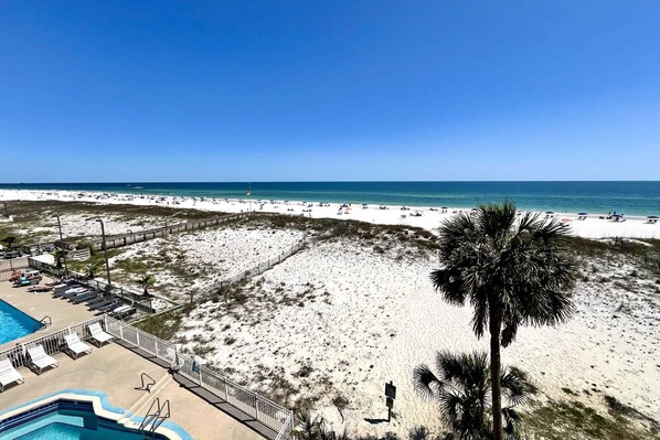 Enjoy ocean views and relax by the pool with lounge chairs on the deck.