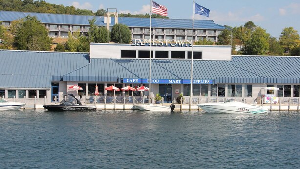 A waterfront building named Jamestown with a cafe, food mart, and upper levels. - Lake Cumberland Hideaway #1-2 miles from Jtown Marina! Boat Parking & Fire Pit! (Jamestown)