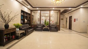 A spacious lobby with a seating area, a reception desk, and a decorative plant. - Western Hanoi Boutique Hotel (Hanoi)