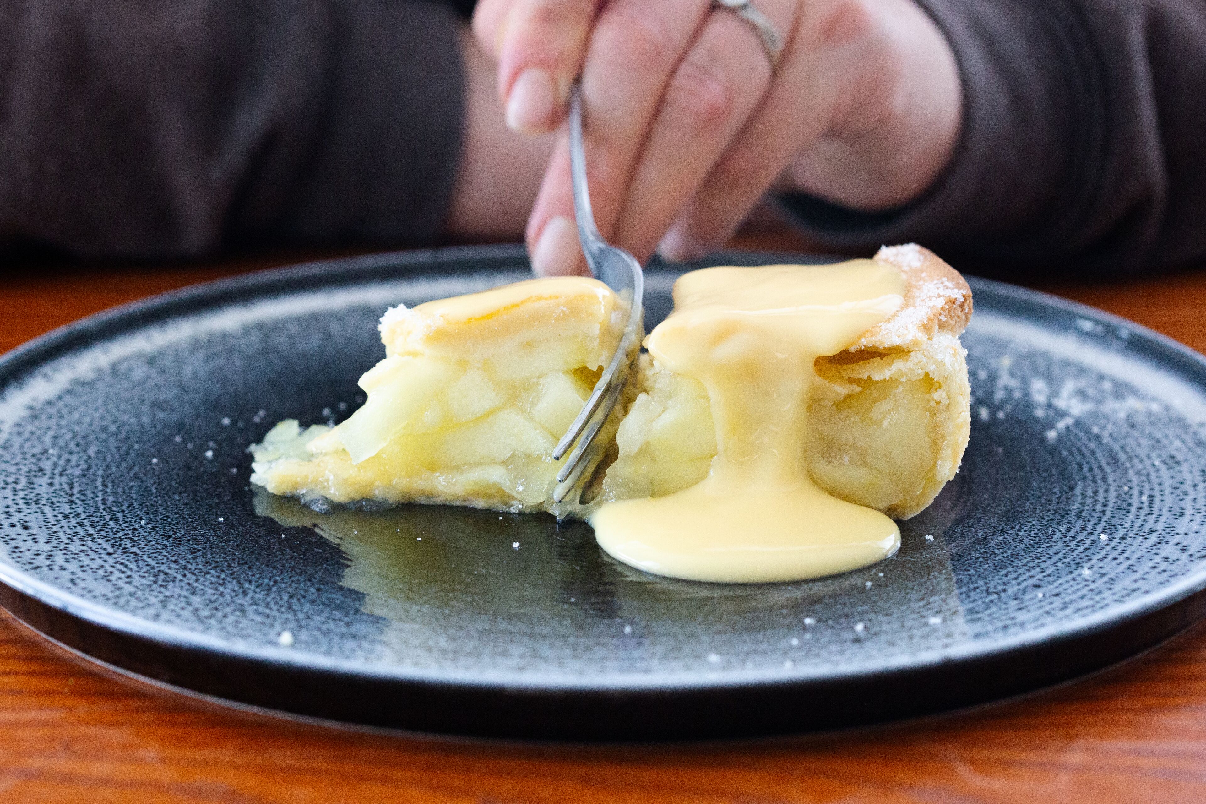 A dessert on a plate with a fork.