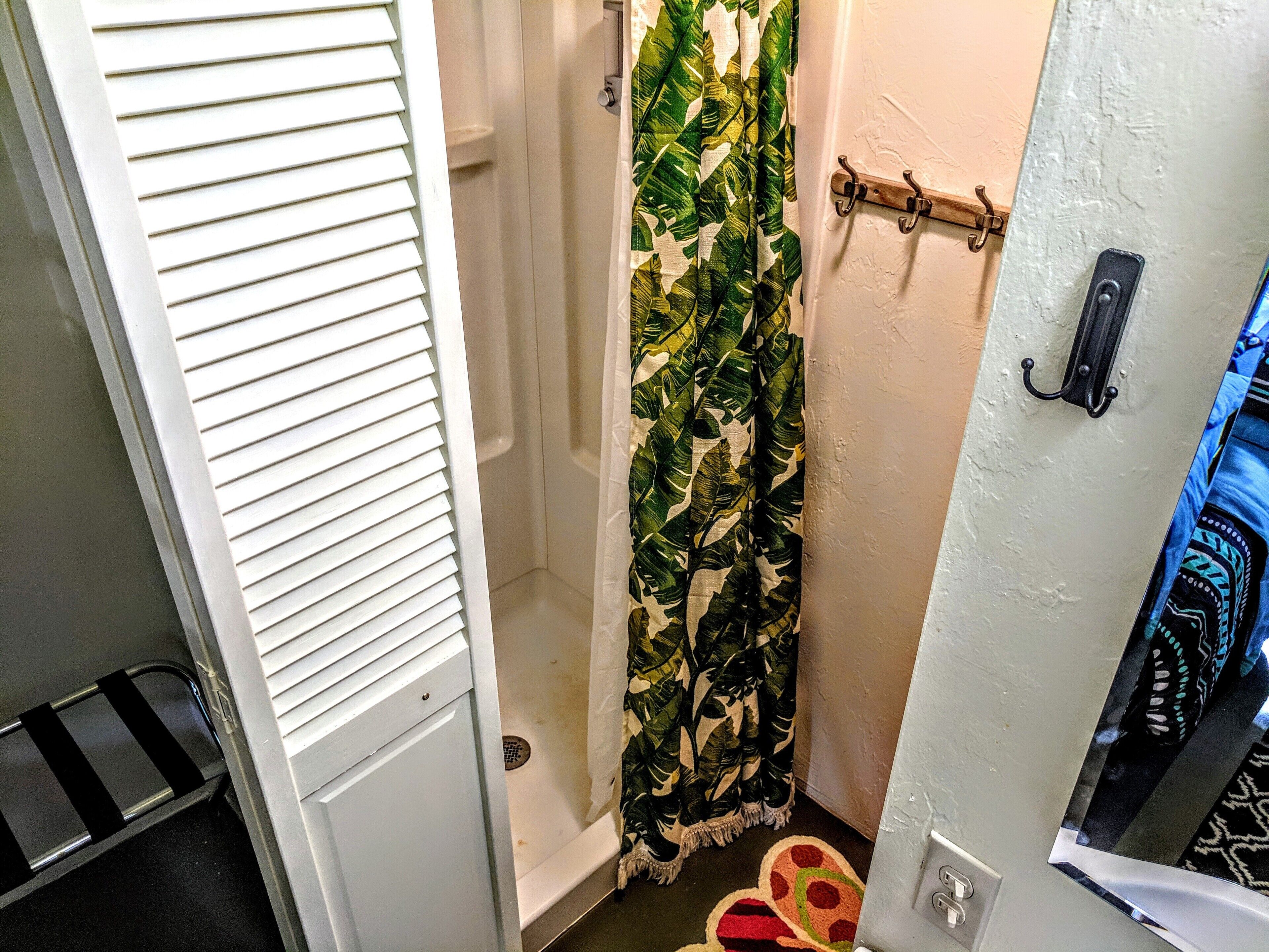 Shower, hair dryer, towels, shampoo