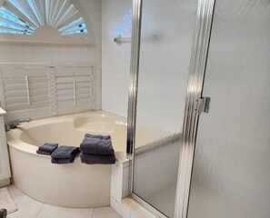 Bathtub, hair dryer, towels, soap