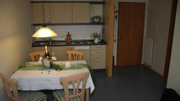 Apartment, Balcony | Private kitchen | Fridge, microwave, stovetop, coffee/tea maker