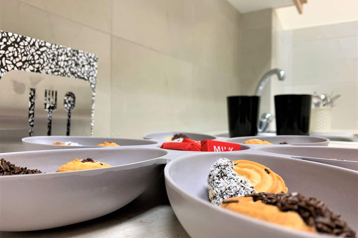 fridge, coffee/tea maker, electric kettle, cookware/dishes/utensils