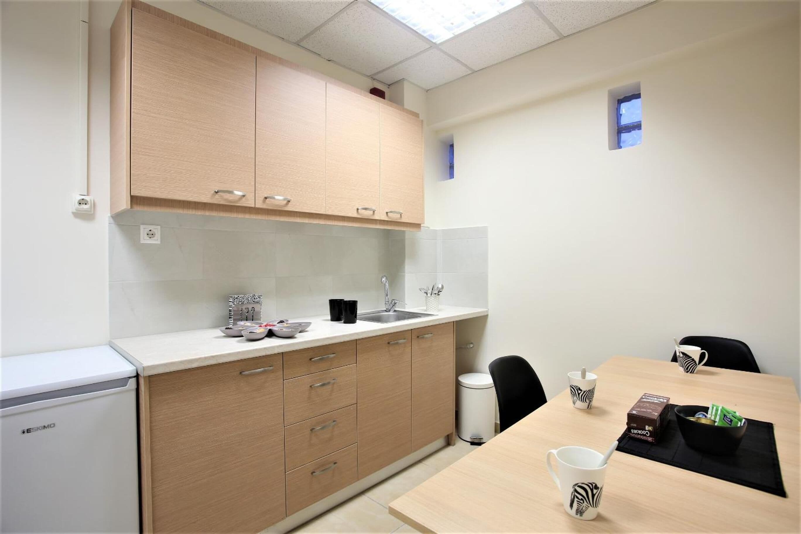 fridge, coffee/tea maker, electric kettle, cookware/dishes/utensils