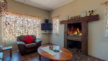 Apartment, 2 Bedrooms | Living area | 32-inch flat-screen TV with cable channels, TV, fireplace