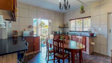 Apartment, 2 Bedrooms | Private kitchen | Full-sized fridge, microwave, electric kettle, cookware/dishes/utensils