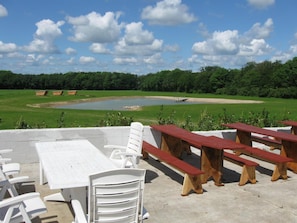 Relax in a serene outdoor space with a patio, table, and comfortable seating.