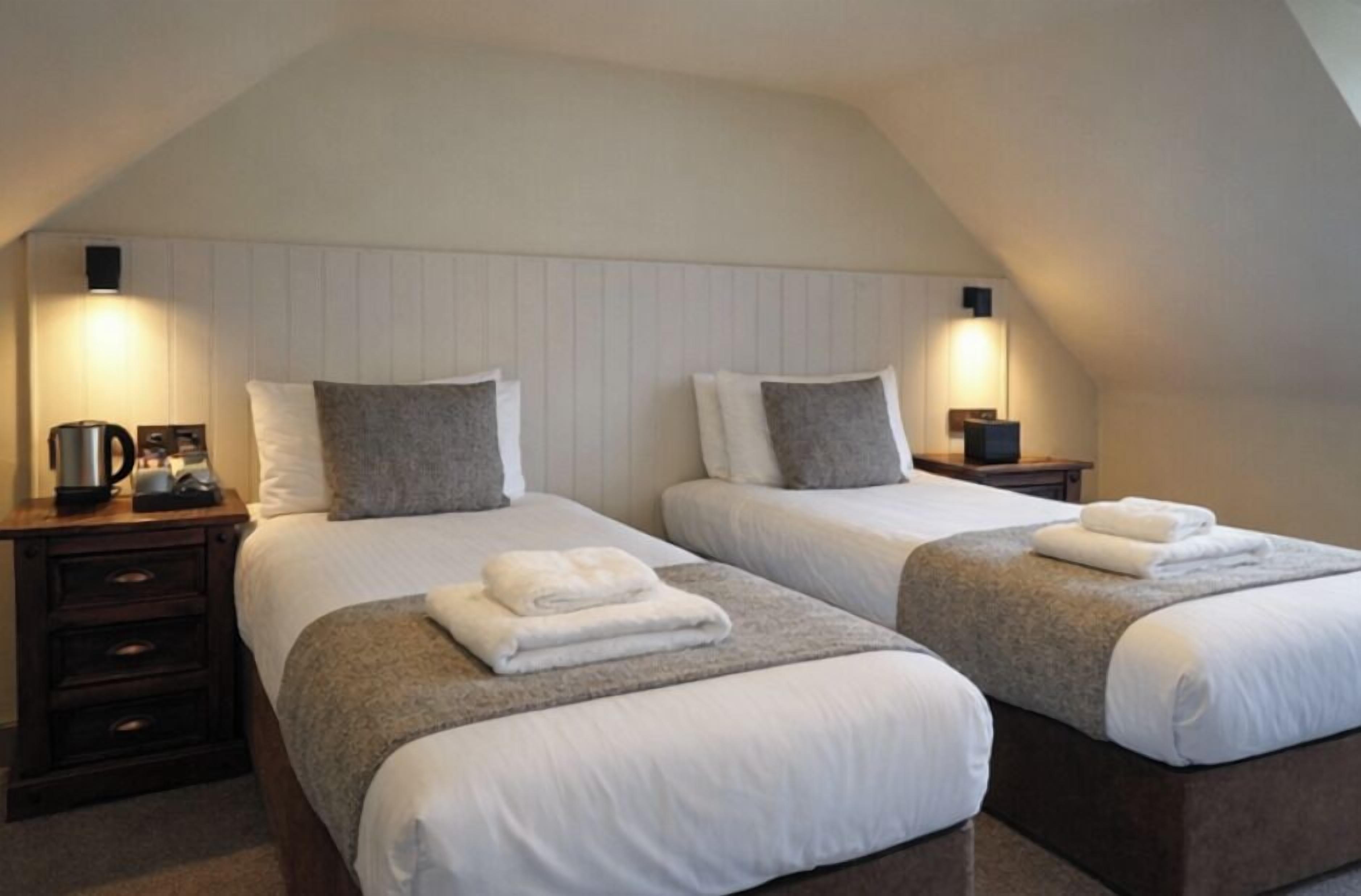 Deluxe Twin | Premium bedding, blackout drapes, iron/ironing board, free WiFi